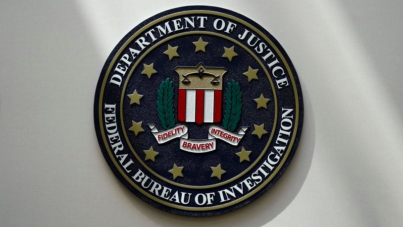 FILE - An FBI seal is seen on a wall on Aug. 10, 2022, in Omaha, Neb. Violent crime in the US dropped again in 2023, according to FBI statistics that show a continued trend downward after a coronavirus pandemic-era crime spike. The report released Monday shows overall violent crime ticked down an estimated 3% in 2023 from the year before, according to the FBI. (AP Photo/Charlie Neibergall, File)