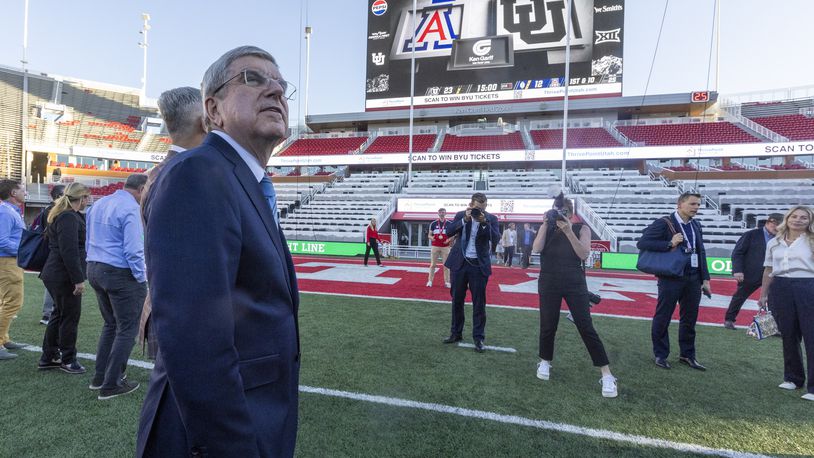 International Olympic Committee President Thomas Bach tours University of Utah's Rice-Eccles Stadium as he leads a delegation visiting ahead of the 2034 Winter Olympics, on the campus of the university in Salt Lake City on Friday, Sept. 27, 2024. (Brice Tucker/The Deseret News via AP)