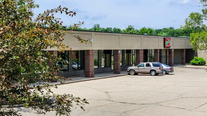 The strip center adjacent to the Monroe Police department is mostly vacant with Cassano's Pizza being one of the only businesses in the building. The city hopes a $400,000 grant helps make improvements to the center. NICK GRAHAM/STAFF