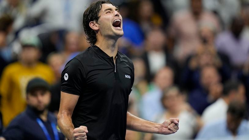 Taylor Fritz, of the United States, reacts after defeating Frances Tiafoe, of the United States, during the men's singles semifinals of the U.S. Open tennis championships, Friday, Sept. 6, 2024, in New York. (AP Photo/Seth Wenig)