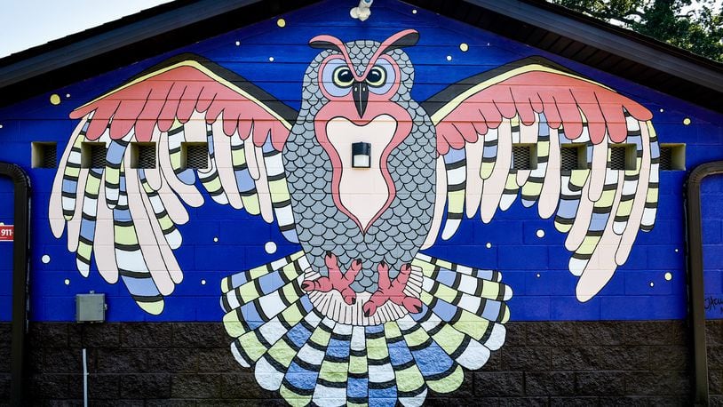 This is one of six bird murals designed and painted by Jenn Acus-Smith with the help of others in Hamilton Parks Conservancy parks in Hamilton. This one is at Millikin Woods Park on North Washington Boulevard. The murals were made possible by an anonymous donation. NICK GRAHAM/STAFF