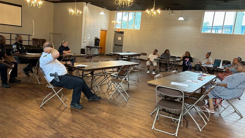 Several members of the Middletown Division of Police, including Chief David Birk, met with NAACP members Tuesday night at the Robert "Sonny" Hill Jr. Community Center. RICK McCRABB/STAFF