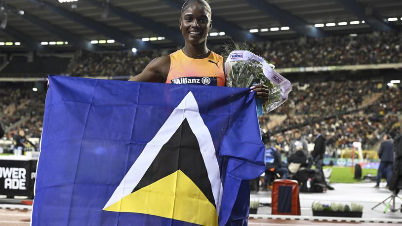 Julien Alfred, of Saint Lucia, poses after winning the women's 100 meters during the Diamond League final 2024 athletics meet in Brussels, Friday, Sept. 13, 2024. (AP Photo/Frederic Sierakowski)