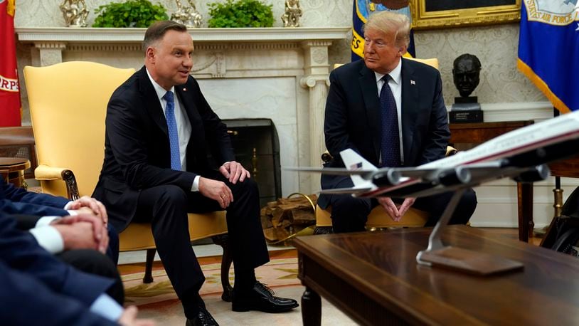 FILE - Then-President Donald Trump meets with Polish President Andrzej Duda in the Oval Office of the White House, June 24, 2020, in Washington. (AP Photo/Evan Vucci, File)