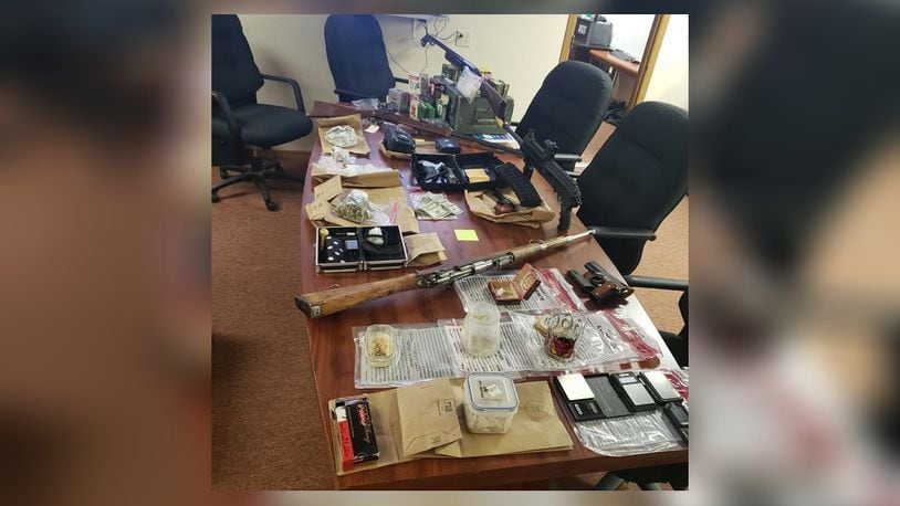 Butler County law enforcement on Dec. 16, 2021 served search warrants at a Trenton home that resulted in the confiscation of firearms, methamphetamine, LSD and a large amount of cash.