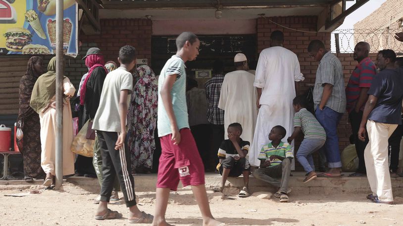 FILE -People line up in front of a bakery during a cease-fire in Khartoum, Sudan, May 27, 2023. (AP Photo/Marwan Ali, File)