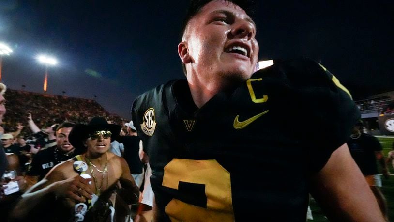 Vanderbilt quarterback Diego Pavia (2) celebrates the team's 40-35 win against Alabama after an NCAA college football game Saturday, Oct. 5, 2024, in Nashville, Tenn. (AP Photo/George Walker IV)