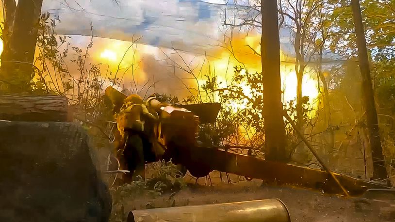 In this photo taken from video released by Russian Defense Ministry Press Service on Wednesday, July 3, 2024, Russian soldiers fire from their 152-mm «Giatsint-B» howitzer from their position at Ukrainian troops at an undisclosed location in Ukraine. (Russian Defense Ministry Press Service via AP)