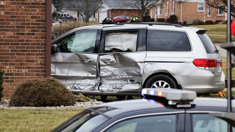 A van crashed into apartment at intersection of NW Washington Boulevard and Cleveland Avenue on Wednesday afternoon in Hamilton. One person in the van was transported to the hospital by ambulance. NICK GRAHAM/STAFF