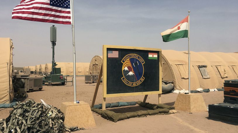 FILE - U.S. and Niger flags fly at the Niger Air Base 201 in Agadez, Niger, April 16, 2018. (AP Photo/Carley Petesch, File)