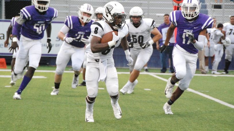 Lakota East’s Donny Wilkinson (8) is chased by Middletown’s Kenny Wilson (17) during Friday night’s game at Barnitz Stadium in Middletown. East won the Greater Miami Conference opener 32-7. CONTRIBUTED PHOTO BY OLIVER SANDERS