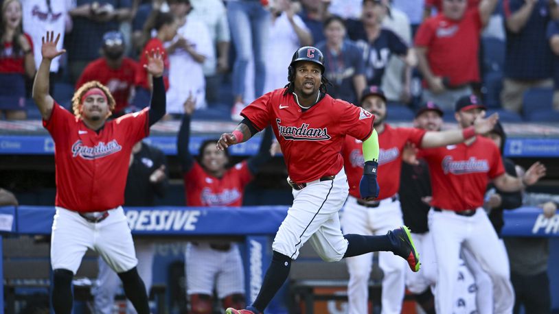 Cleveland Guardians' José Ramírez scores on a walk off RBI single hit by Andrés Giménez to defeat the Minnesota Twins 3-2 in 10 innings in a baseball game, Thursday, Sept. 19, 2024, in Cleveland. (AP Photo/Nick Cammett)