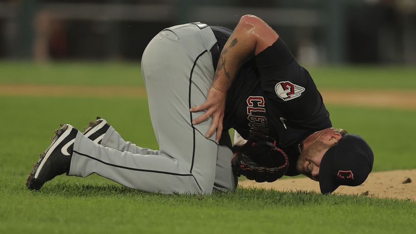 Cleveland Guardians' pitcher Ben Lively lays on the field after being hit by a ball during the second inning of a baseball game against the Chicago White Sox, Tuesday, Sept. 10, 2024, in Chicago. (AP Photo/Melissa Tamez)