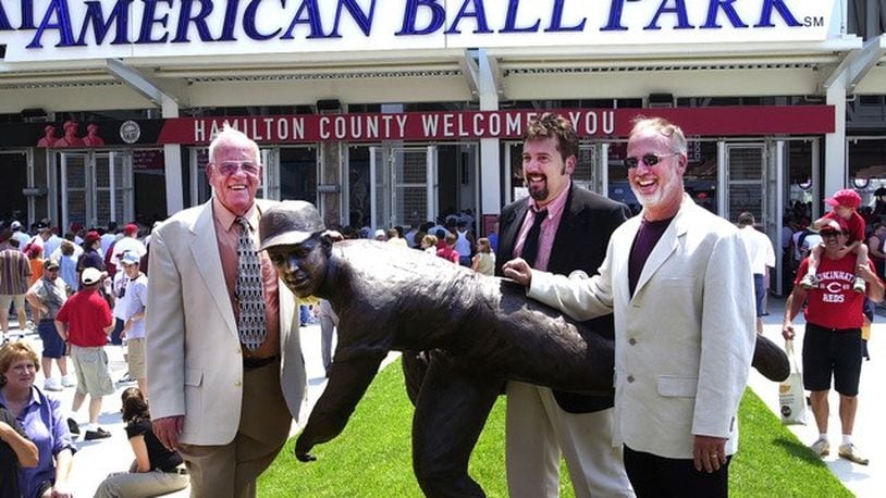 Pictured is the Reds Hall of Fame pitcher and former longtime radio announcer, the late Joe Nuxhall, with his sons, Kim (at right) and Phil. Pictured is when the elder Nuxhall had his statue dedicated outside Great American Ball Park in downtown Cincinnati. PROVIDED