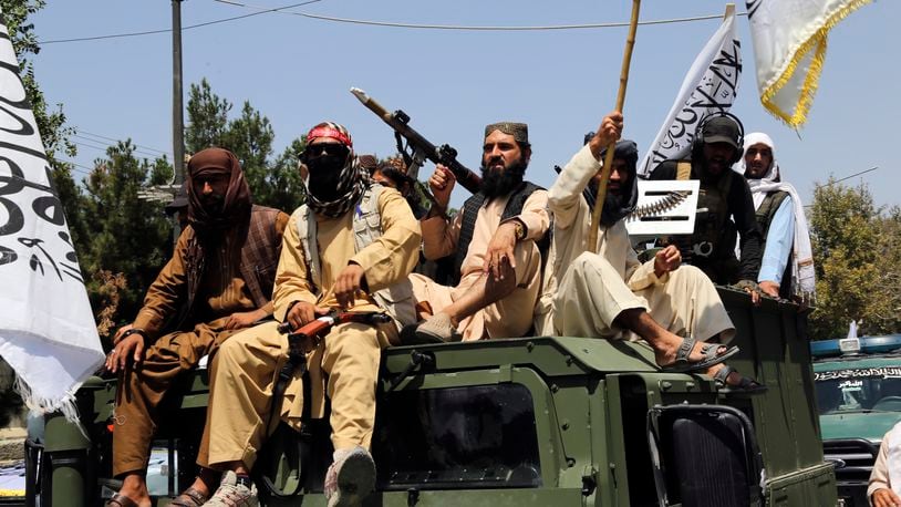 Taliban fighters celebrate the third anniversary of the withdrawal of US-led troops from Afghanistan, in Kabul, Afghanistan, Wednesday, Aug. 14, 2024. (AP Photo/Siddiqullah Alizai)