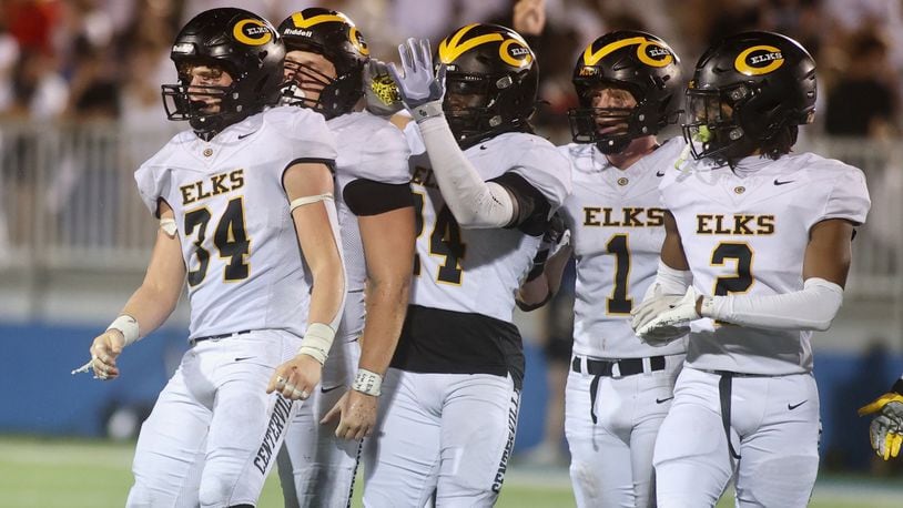 Centerville players, including Lucas Mullinger (34), react after a defensive stop against Fairmont on Friday, Sept. 13, 2024, at Roush Stadium. David Jablonski/Staff