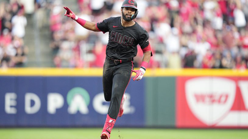 Cincinnati Reds' Rece Hinds rounds the bases after hitting his career first MLB grand slam during the third inning of a baseball game against the Miami Marlins, Friday, July 12, 2024, in Cincinnati. (AP Photo/Jeff Dean)