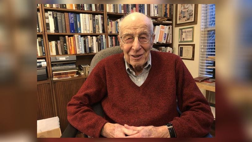 Dr. Al Miller, seen here at age 97, a Holocaust survivor, was an optometrist in Hamilton for more than 40 years before retiring and moving to Deerfield Twp. He converted a bedroom into an extensive library. RICK McCRABB/STAFF