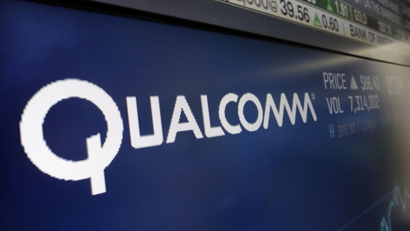 FILE - This Wednesday, Feb. 14, 2018 file photo shows the logo for Qualcomm on a screen at the Nasdaq MarketSite, in New York. (AP Photo/Richard Drew, File)