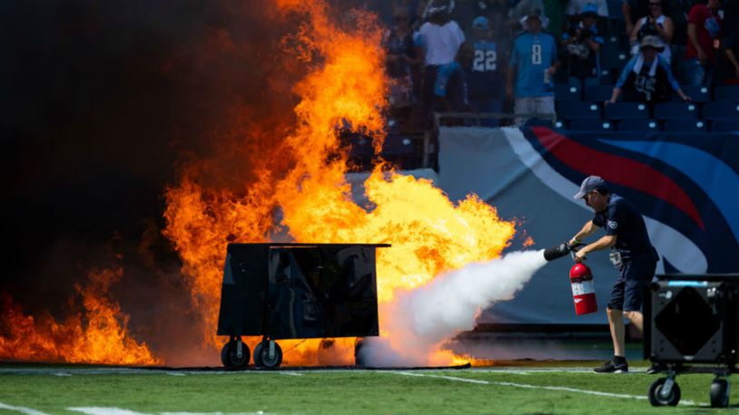 A failed pyrotechnic device bursts into flames Sunday before the game between the Tennessee Titans and the Indianapolis Colts at Nissan Stadium.