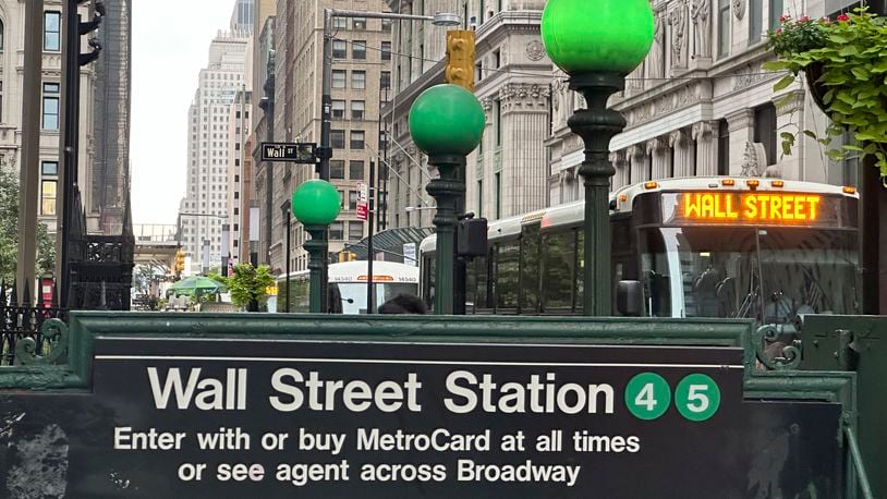 A bus passes the Wall St. subway station on Wednesday, Sept. 18, 2024, in New York. (AP Photo/Peter Morgan)