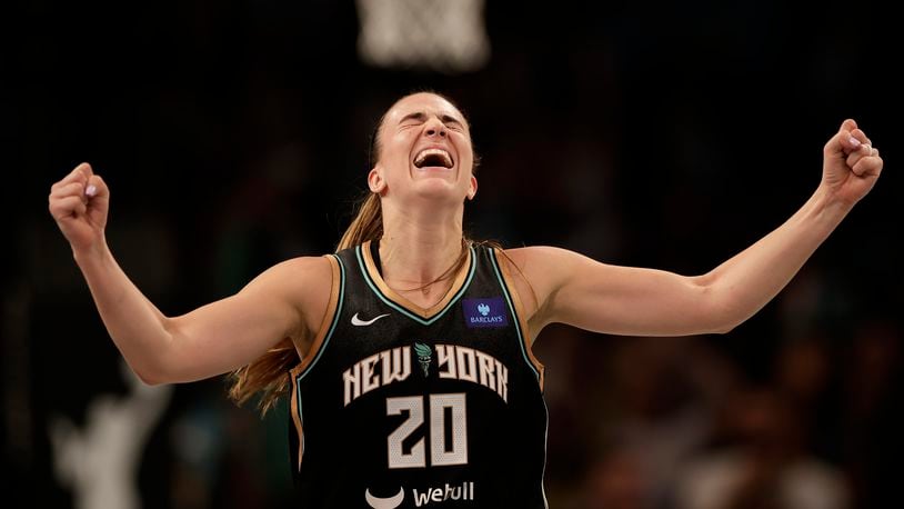 New York Liberty guard Sabrina Ionescu reacts during the second half of a first-round WNBA basketball playoff game against the Atlanta Dream, Tuesday, Sept. 24, 2024, in New York. The Liberty won 91-82 to clinch the series 2-0. (AP Photo/Adam Hunger)