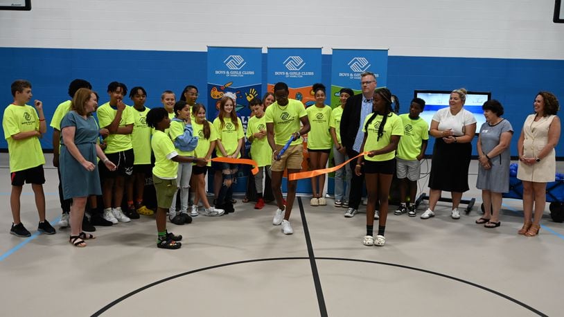With the state of potential state funding, the Boys and Girls Clubs of Hamilton celebrated the newly renovate gym floor of its Grand Boulevard location. Ohio Rep. Sara Carruthers, R-Hamilton, is pushing for the state to provide funding for the project, which has already passed the Ohio House. MICHAEL D. PITMAN/STAFF