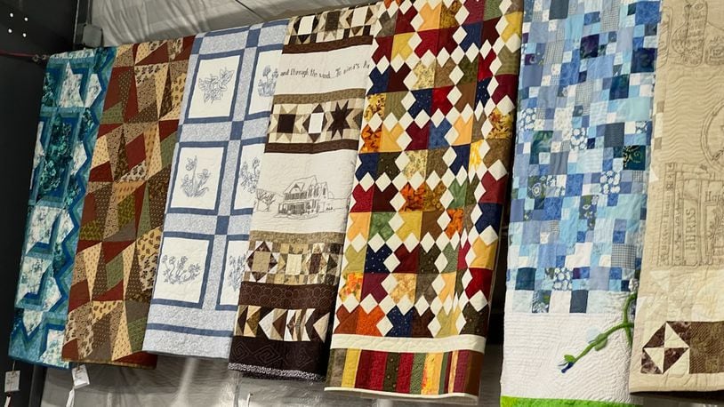 Quilts are displayed in the Art Hall at the 2023 Butler County Fair in Hamilton. These quilts are part of the Open Class submissions that are judged every year. The fair will run through Saturday. AMY BURZYNSKI/STAFF