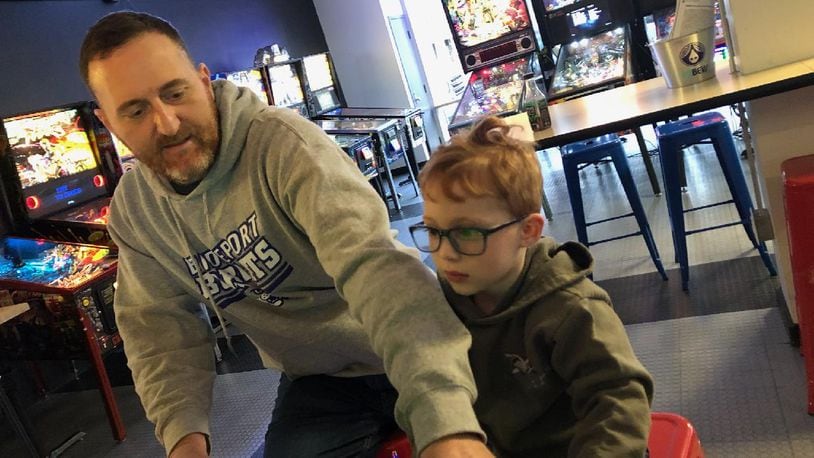 Jim Foliano, executive director of Ticket To Hope, practicing pinball at the Pinball Garage. Foliano is playing pinball on an Avengers: Infinity Quest Pinball Machine, the new machine that will be donated to The Hope Center. CONTRIBUTED