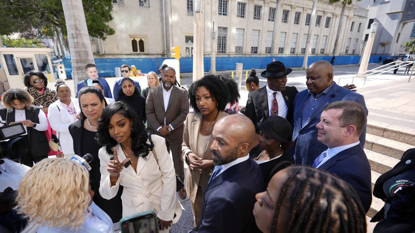 FILE - Co-founders and CEOs of The Fearless Fund Arian Simone, center left, and Ayana Parsons, center right, speak to journalists outside the James Lawrence King Federal Building in Miami, as they leave with their legal team following a hearing on Wednesday, Jan. 31, 2024. (AP Photo/Rebecca Blackwell, File)