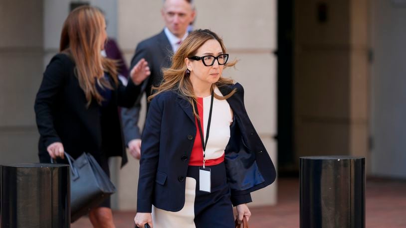 Jeannie Rhee, a lawyer representing Google in the Department of Justice's antitrust case against the tech giant, leaves the U.S. District Court for the Eastern District of Virginia for a break in the trial, Monday, Sept. 9, 2024, in Alexandria, Va. (AP Photo/Stephanie Scarbrough)