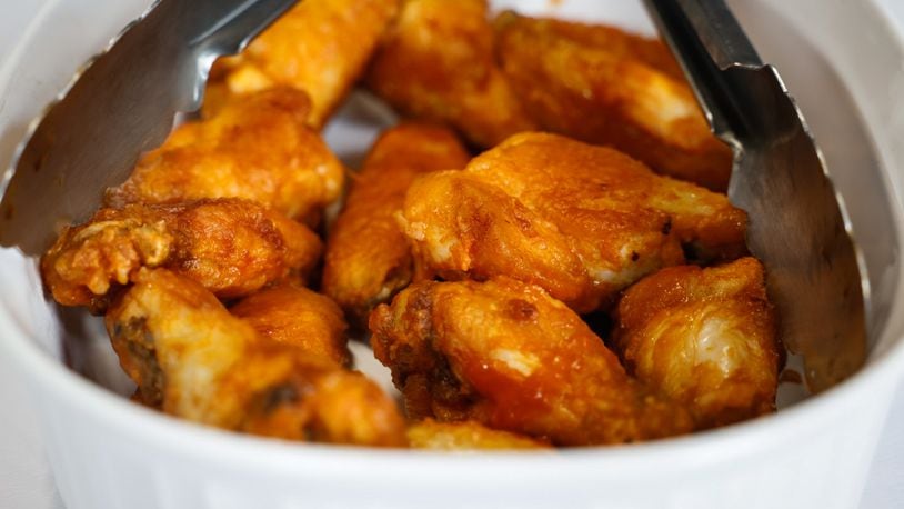 Cox First Media asked readers to submit their very best, easy-to-follow tailgating recipes. The Southern Style Hot Wings sent in by T.J. Justice of Moraine won third place. JIM NOELKER/STAFF