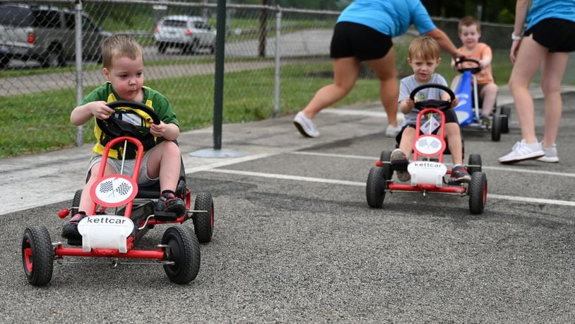 The Butler County Board of Development Disabilities and the Hamilton Safety Council partnered to offer a pilot program for kids with developmental disabilities to participate in Safety Town. Four and 5 year-olds are participating in the pilot program now through Aug. 2 at Officer Bob Gentry Park in Hamilton. From Aug. 5 to 9, kids ages 6 to 8 will participate in Safety Town. Pictured is Lucas (left) navigating the Safety Town street course with Bentley right behind him. MICHAEL D. PITMAN/STAFF