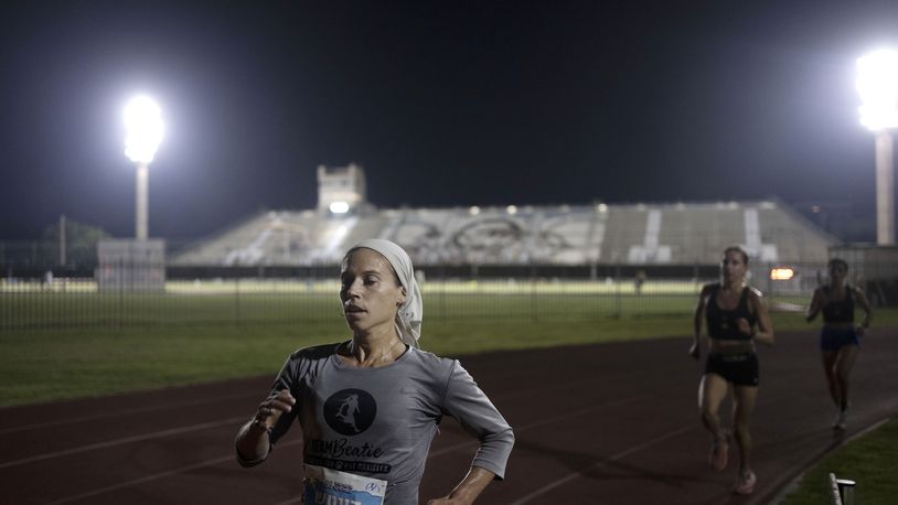Beatie Deutsch, an Orthodox Jewish runner, trains in Tel Aviv, Israel, Wednesday, June 26, 2024. "I'd love governing bodies of sports to do more to accommodate religion," said the 34-year-old mother of five. She qualified to represent Israel in the 2020 Tokyo Olympics but didn't compete because the women's marathon was scheduled for a Saturday, when she observes shabbat. (AP Photo/Maya Alleruzzo)
