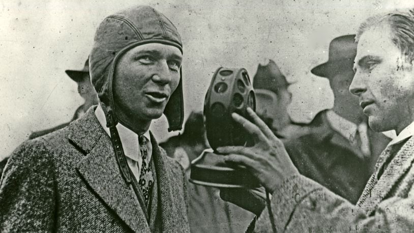 John C. Slade (right) holding WRK microphone during a 1928 interview with Clarence E. Chamberlin (left) at the Hamilton Ford airport. Photograph courtesy of the George C. Cummins photo collection at Lane Public Library.