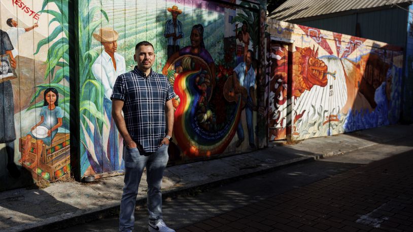 Luis A. Torres stands for a portrait at Balmy Alley in the Latino Cultural District on Friday, Sept. 20, 2024, in San Francisco. (AP Photo/Juliana Yamada)