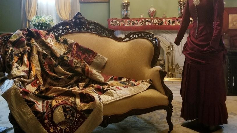 Fancy Crazy Quilt, dated 1883, is one that is paired with fashion to show that sources of quilting fabric were textiles manufactured for clothing. The outfit on the mannequin is an 1883 high school graduation dress. CONTRIBUTED