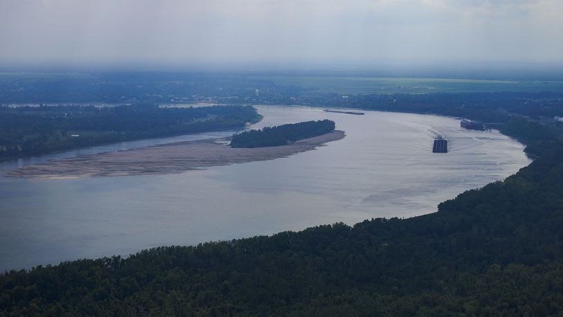 FILE - In this aerial photo a tugboat pushing barges navigates around sandbars amid low water levels on the Mississippi River in Livingston Parish, La., Sept. 14, 2023. (AP Photo/Gerald Herbert, File)