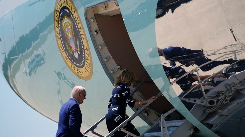 President Joe Biden, left, and first lady Jill Biden board Air Force One at Raleigh-Durham International Airport, Friday, June 28, 2024, in Raleigh, N.C. (AP Photo/Evan Vucci)