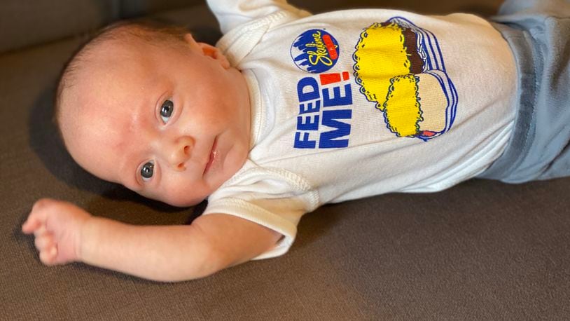 A baby with a Skyline Chili shirt