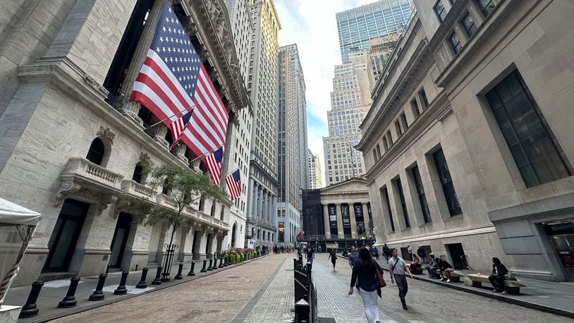 FILE - American flags hang from the front of the New York Stock Exchange on Sept. 11, 2024, in New York. (AP Photo/Peter Morgan, File)