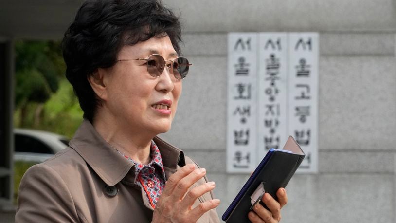 Han Tae-soon speaks during a press conference in front of the Seoul Central District Court in Seoul, South Korea Monday, Oct. 7, 2024 before she sues her government, an adoption agency and an orphanage over the adoption of her daughter. (AP Photo/Ahn Young-joon)