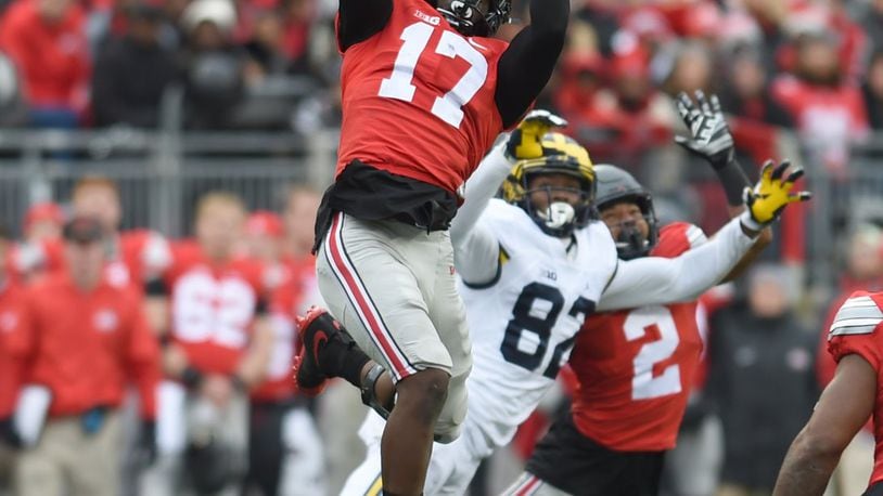 Ohio State linebacker Jerome Baker makes a leaping interception during the Buckeyes 30-27 win over Michigan on Saturday Nov. 26, 2016.