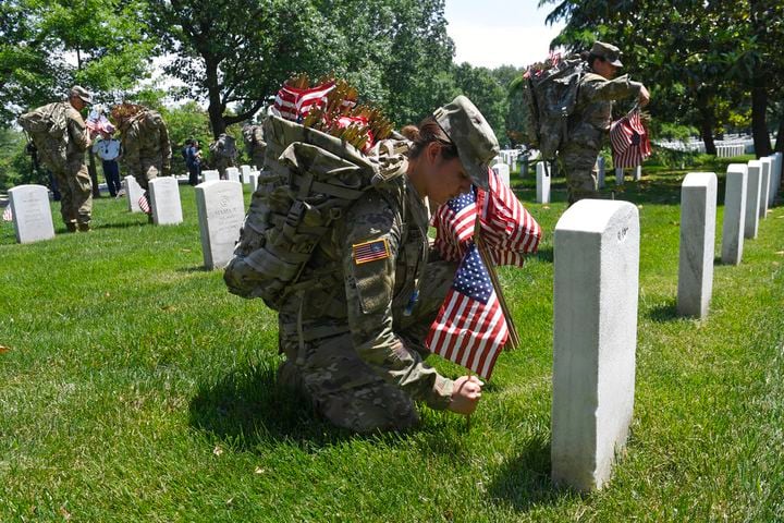 Soldiers place flags at Arlington National Cemetery for Memorial Day