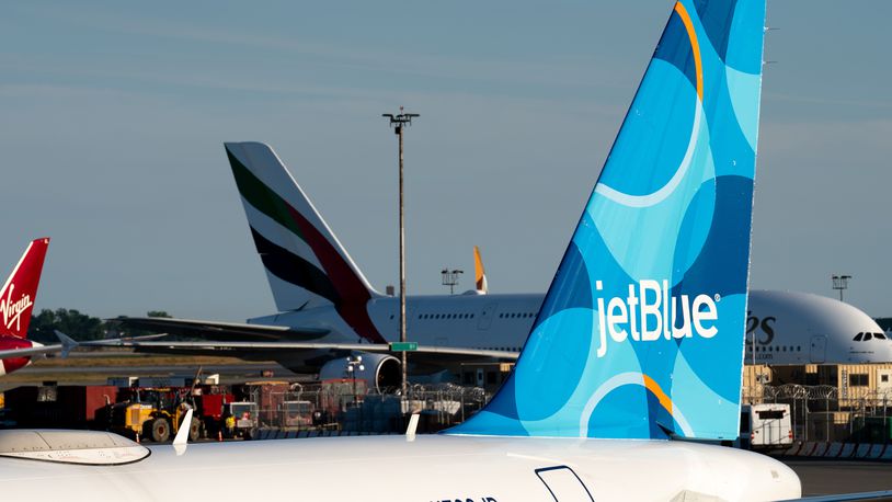 FILE - A JetBlue airplane is seen parked on the tarmac at John F. Kennedy International Airport on Tuesday, June 28, 2022, in New York. (AP Photo/Julia Nikhinson, File)