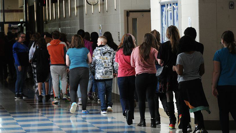 File - Students at Miamisburg Middle School walk through the hallways on May 5, 2022. Montgomery County will be expanding its access to intensive home-based behavioral health treatment for children after the Ohio Department of Medicaid announced additional grant funding in May 2024. This type of treatment helps children in settings they are familiar with, such as home or school, to treat mental or emotional health problems that are disrupting their day-to-day functioning. MARSHALL GORBY\STAFF FILE