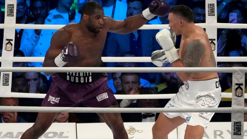 FILE - Britain's Daniel Dubois, left, and Ukraine's Oleksandr Usyk during their world heavyweight title fight at Tarczynski Arena in Wroclaw, Poland, Saturday, Aug. 26, 2023. (AP Photo/Czarek Sokolowski, file)