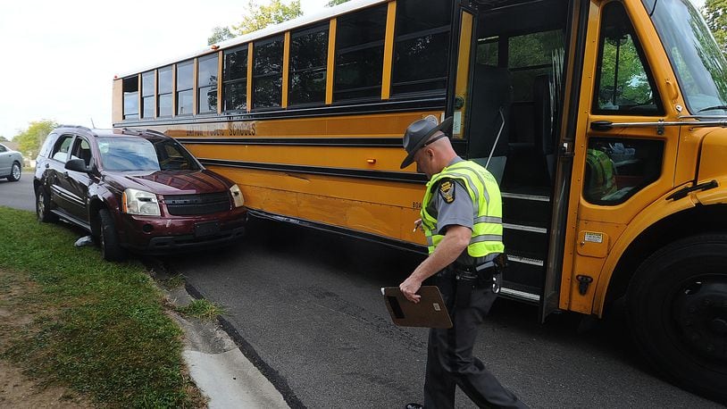 In this file photo from September, the Ohio State Highway Patrol investigated a crash involving a Dayton Public School bus in Harrison Twp. One child was injured. MARSHALL GORBY\STAFF