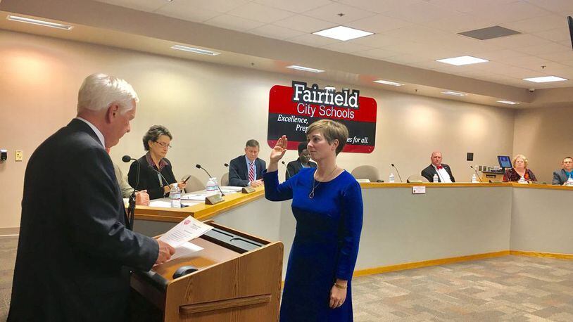 Fairfield Board of Education member Carrie O'Neal, shown here being sworn in during a 2017 meeting, has announced her resignation from the governing board overseeing the 10,000-student district. O'Neal says she plans to move outside the school system. (File Photo\Journal-News)