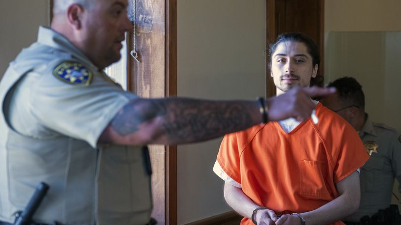 FILE - Ryan Martinez is led into court for a preliminary and detention hearing at the Rio Arriba Courthouse, in Tierra Amarilla, N.M., Friday, Oct. 13, 2023. (Eddie Moore/The Albuquerque Journal via AP, File)